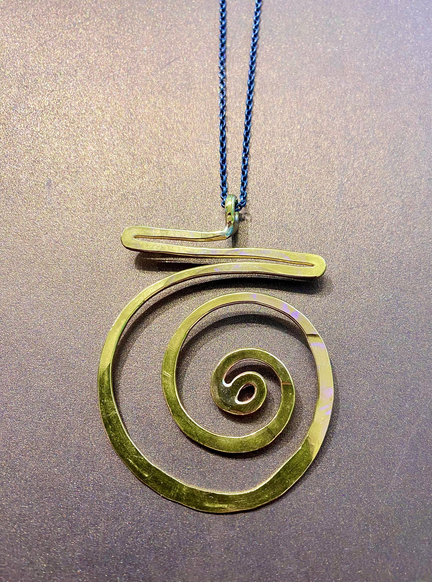 Brass swirl pendant